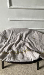 Bottom fabric draped over the stool
