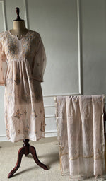 The set on the mannequin with its dupatta beside it