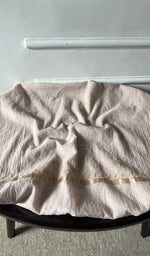 Bottom fabric draped over the stool
