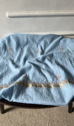 Bottom fabric draped over the stool