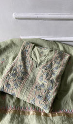 green pure mul chanderi kurta piece folded, fine chikankari with haath ki jaali on semi stitch gathers s