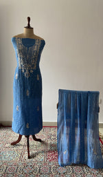 The set on the mannequin with its dupatta beside it