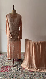 The set on the mannequin with its dupatta beside it