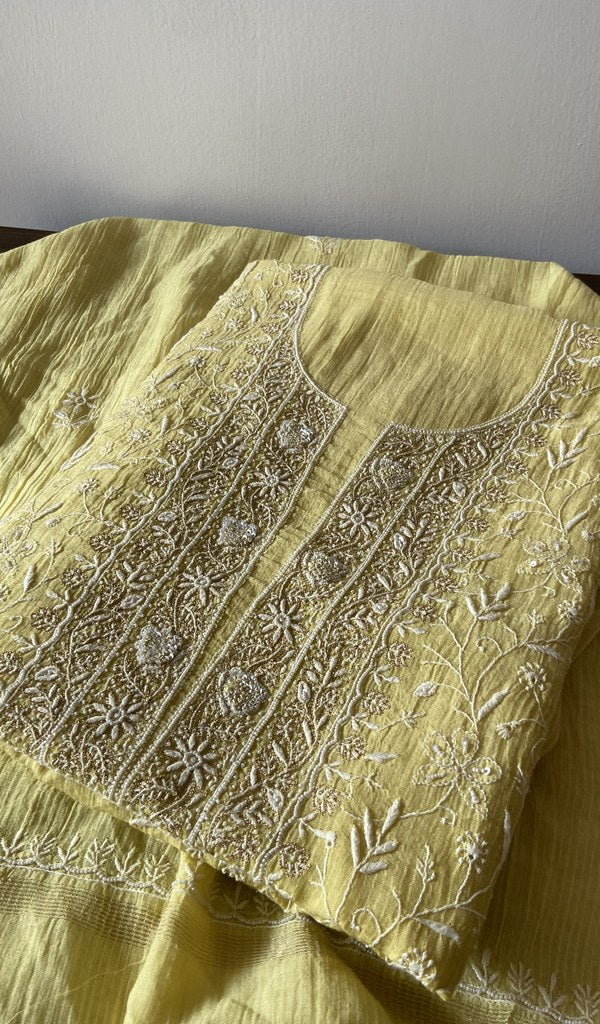 Yellow pure maheshwari mul chanderi kurta piece folded, do taar and teen taar chikankari in view