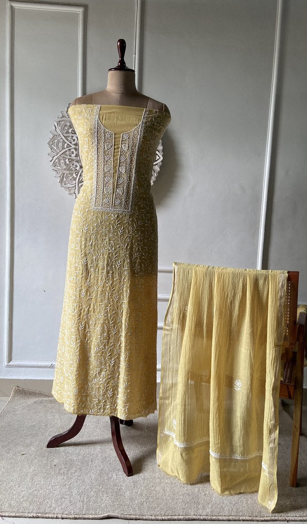 Yellow suit set on the mannequin with its dupatta
