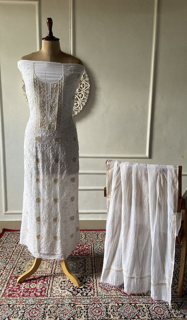 Off white pure maheshwari mul chanderi chikankari 2 pc unstitched suit set laid out