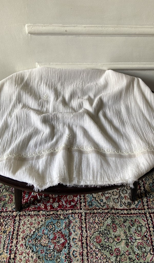 Chikankari across the body of the off kurta piece
