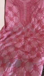 Pink tussar silk laid flat on the table