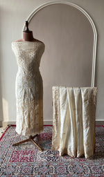 Beige tussar silk set on the mannequin with its dupatta