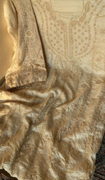 Beige tussar silk laid out flat