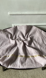 Bottom fabric draped over the stool