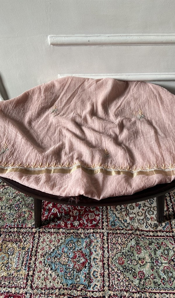 Chikankari across the body of the dusty kurta piece