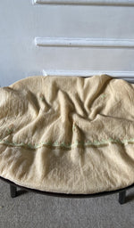 Bottom fabric draped over the stool