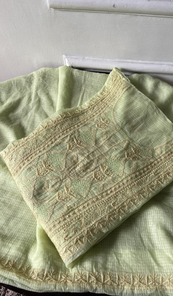 pale yellow green chikankari set folded, worked panel on top