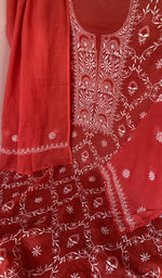 Motifs across the body of the red kurta
