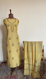 Butter yellow mul chanderi set on the mannequin with its dupatta