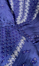 close view of the fine chikankari on panel and motifs highlighted with heavy beads sequins and cutdana