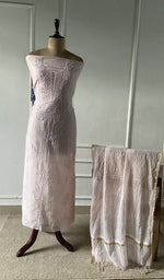 The set on the mannequin with its dupatta beside it