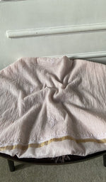 Bottom fabric draped over the stool
