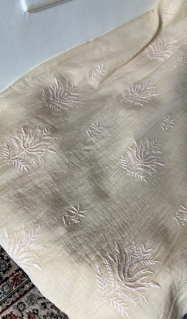 Chikankari across the body of the pale kurta piece
