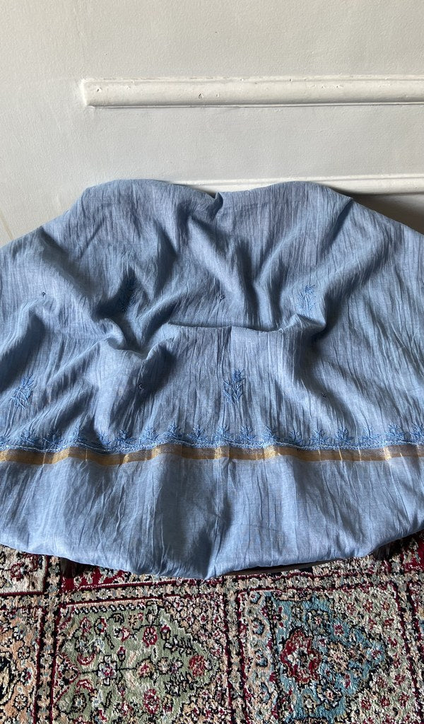 Light blue mul chanderi chikankari 3 pc unstitched suit set laid out