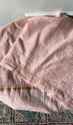 border and hem of the peach kurta piece