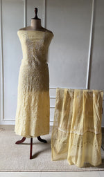 yellow pure mul chanderi chikankari set on the mannequin with the dupatta