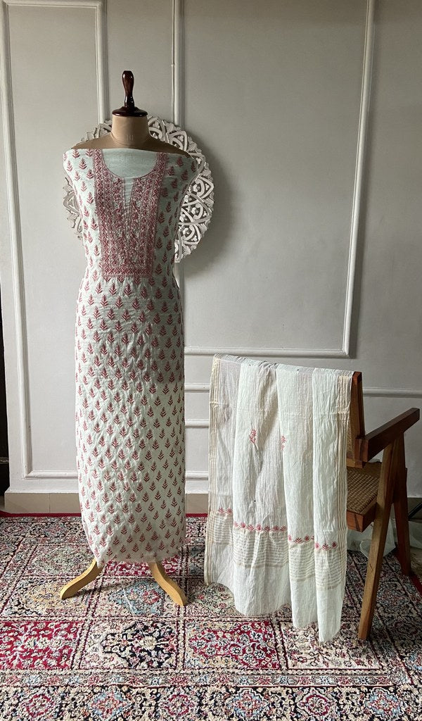 mint green pure mul chanderi chikankari set on the mannequin, dupatta on the stand