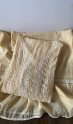 Yellow pure mul chanderi kurta piece folded, fine chikankari with haath ki jaali