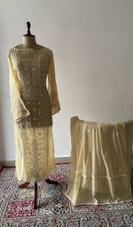 The set on the mannequin with its dupatta beside it