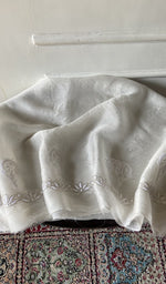 Off white pure organza silk chikankari 2 pc unstitched suit set laid out