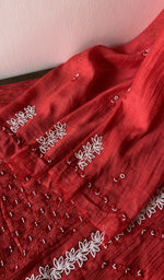 The kurta piece folded on the carpet