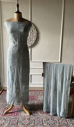 将图像加载到图库查看器中， Grey blue viscose georgette chikankari 2 pc unstitched suit set laid out