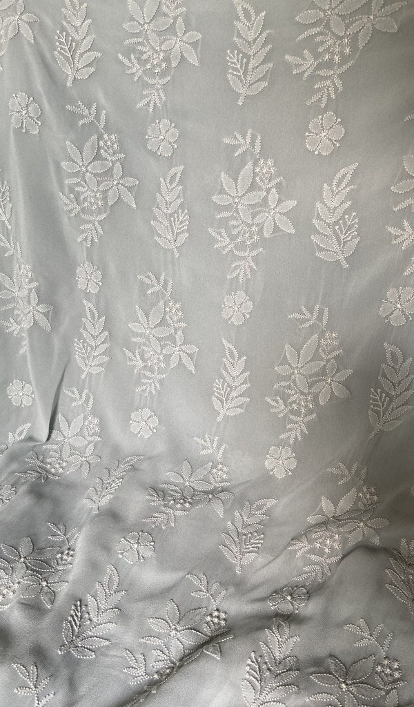 Border and hem of the grey blue viscose georgette