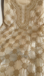 Beige tussar silk laid flat on the table