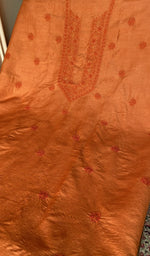 Burnt orange eri silk laid out flat