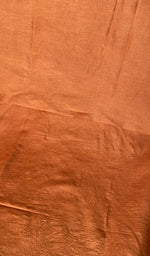 Close view of the burnt orange kurta fabric