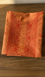 Folded tangerine orange eri silk kurta, front view