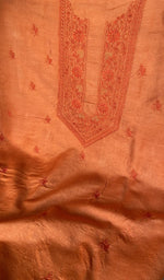 Tangerine orange eri silk laid out flat