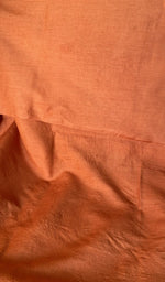 Close view of the tangerine orange kurta fabric