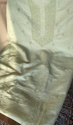 Mint green eri silk laid out flat