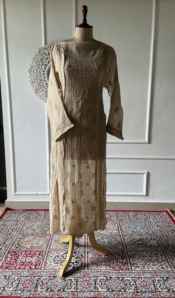 beige pure mul chanderi chikankari kurta fabric on the mannequin