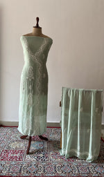 Green pure mul chanderi chikankari suit set on the mannequin with its dupatta