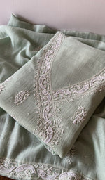 Folded kurta piece and dupatta, chikankari along the hem