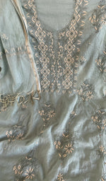 Motifs across the body of the grey kurta