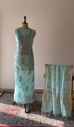 The set on the mannequin with its dupatta beside it