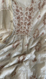 Motifs across the body of the beige kurta