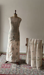 The set on the mannequin with its dupatta beside it