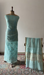 The set on the mannequin with its dupatta beside it