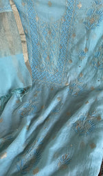 Motifs across the body of the blue kurta